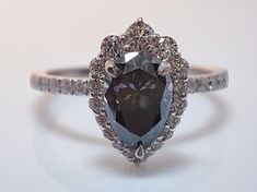 a fancy ring with an oval cut diamond