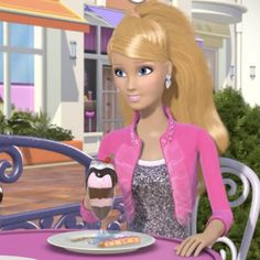 a barbie doll sitting at a table with an ice cream sundae