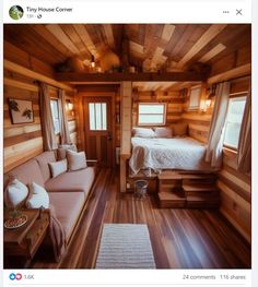 a tiny cabin with wood floors and walls