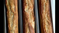 bread sticks lined up on a baking rack