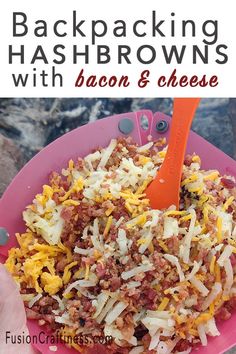 a pink plate topped with bacon and cheese next to a person holding an orange spoon