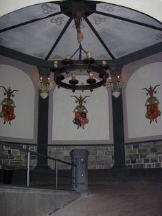 a chandelier hanging from the ceiling in a building