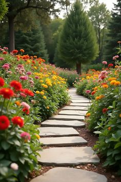 a stone path surrounded by colorful flowers and greenery with trees in the back ground