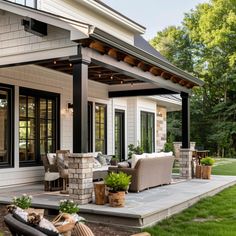 an outdoor patio with furniture and lights