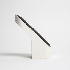 a white and black object sitting on top of a table