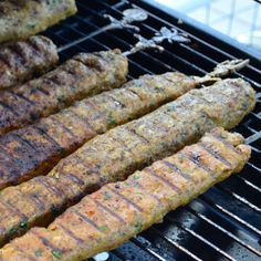 some meat is being cooked on a grill