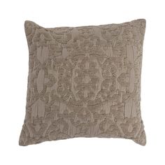 a beige pillow with an intricate design on the front and back, sitting on a white background