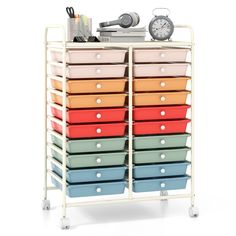 a multicolored storage rack with drawers and a clock on the top one side