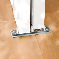 a close up of a tile floor with a mop on it's side