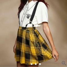 Brand New Never Worn Harry Potter Hufflepuff Pleated Suspender Skirt Size Large Nwt. Add Some Magical Flair To Your Wardrobe With This Harry Potter Suspender Skirt. Featuring A Plaid Print In The Hufflepuff House Colors Plus “Hufflepuff “ Embroidered Along The Side With A Badger . Comes With Removable Adjustable Suspender Straps, Perfect For Adding A Little Extra Prep To Your Look Complete With A Partial Elasticated Waistband And A Side Zipper Closure. 80% Polyester 18% Rayon 2% Spandex Wash Col Harry Potter Skirt, Hufflepuff Outfit, Harry Potter Hufflepuff, Suspender Skirt, Plus Size Fits, Sweaters And Jeans, Plaid Print, Warner Bros, Suspenders