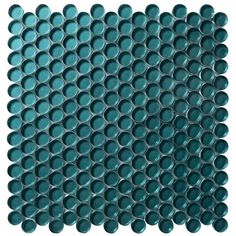 the back side of a blue glass mosaic tile with circles and dots in different sizes