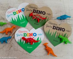 four dinosaur valentine's tags with the word dino on them