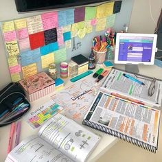 a desk with many papers and pens on it