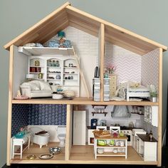 a doll house is shown with all the furniture and accessories in it's display case