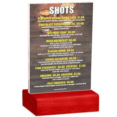 a wooden plaque with a menu on it that says shot's, the appliance show 2012