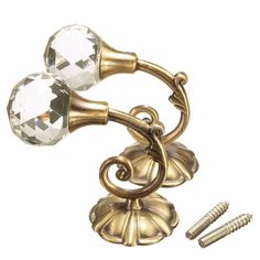 a pair of antique brass door knobs with crystal beads