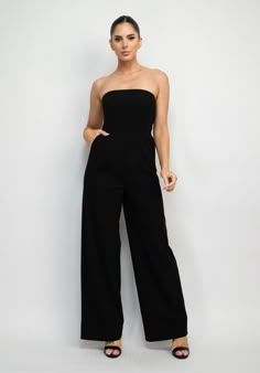 Strapless Wide Leg Jumpsuit Brand: Haute Monde Style: HMP40786 Fabric: 94% POLYESTER, 6% SPANDEX Details: A knit global sleek trend tube jumpsuit in solid color featuring wide leg, princess seams, side pockets, and full-length. Made in Cambodia Black Pantsuit Outfit, Aesthetic Jumpsuits, Prom Jumpsuit Classy, Glamorous Black Strapless Jumpsuit, Black Strapless High-waisted Jumpsuit For Evening, Luxury Fitted Strapless Wide-leg Jumpsuit, Elegant Black Strapless Wide-leg Jumpsuit, Elegant Black V-neck Strapless Jumpsuit, Prom Jumpsuit