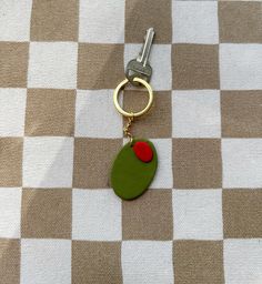 Add something cute and unique to your bags and keys with this handmade polymer clay keychain. Clay Keychain, Arlington Va, Handmade Polymer Clay, Leather Craft, You Bag, Keychains, Polymer Clay, Leather, Gold