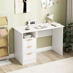 a white desk with two drawers in front of a painting on the wall above it