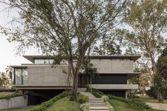 the house is made out of concrete and has stairs leading up to it's roof