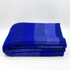 a blue blanket folded on top of each other