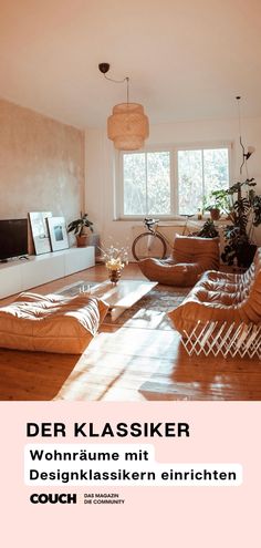 a living room filled with furniture and a flat screen tv sitting on top of a wooden floor