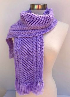 This purple knit lace scarf with braids is one of kind fall/winter accessory for the woman who wants to have something special.The scarf is very soft and has a silky warm texture.  This is a perfect gift for any occasion for any woman making her stylish and fashionable. The scarf has a unique design developed by the crafter. 100 % acrylic yarn. CARE INSTRUCTIONS: Easy to care. Hand wash in warm water is recommended. Let it dry flat on a towel. All items are made in a smoke-free, pets-free home. Scarf With Braids, Purple Shawl Scarf For Winter, Elegant Purple Shawl Scarf, Purple Winter Shawl Scarf, Purple Knitted Winter Scarves, One Size Purple Crochet Scarf, Scarf Lace, Purple Knit, Braided Scarf