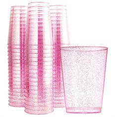 there are many pink glass vases next to each other on this white background,