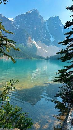 a lake surrounded by mountains and trees