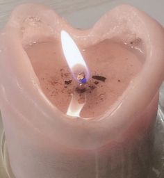 a candle is in the shape of a heart