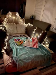 a living room with a couch covered in christmas lights