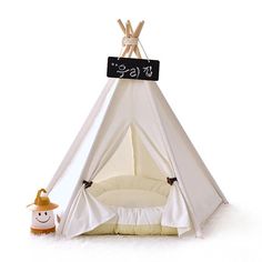 a teepee tent with a sign that says milkee on the front and side