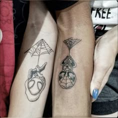 two people with matching tattoos on their arms