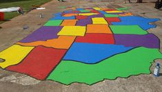 a colorfully painted map is shown on the ground