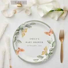 a personalized wedding plate on a table with flowers and napkins next to it