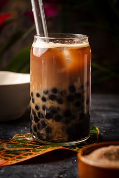 an iced drink in a jar with a straw