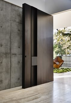 an open door leading into a room with concrete walls