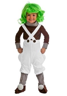 a child in a costume that is wearing green hair and white overalls with suspenders