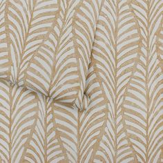 a close up view of a beige and white wallpaper