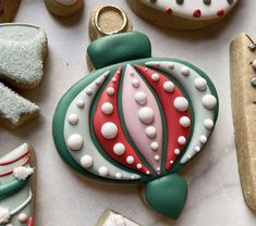 decorated christmas cookies on a white table cloth