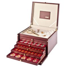 an open wooden box filled with lots of coins