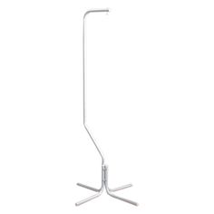 a white floor lamp with two metal poles on each side and one light bulb in the middle