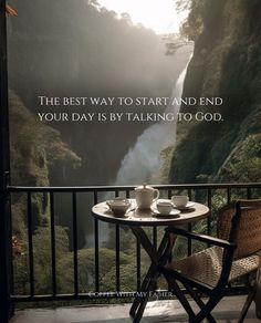 two cups of coffee on a table with a view of a waterfall and the words, the best way to start and end your day is by talking to god