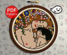 the cross stitch pattern shows two women hugging each other in front of a floral background