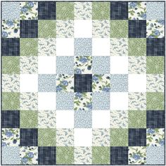 a blue and green patchwork quilt with flowers on the front, one block in the middle