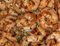 closeup of cooked shrimp with parsley on top