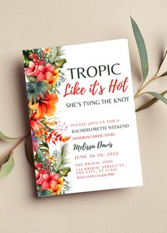 the front cover of a book with tropical flowers on it