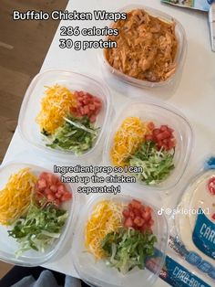 six plastic containers filled with food on top of a table