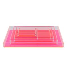 three pink trays sitting on top of each other in front of a white background