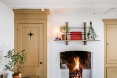 a living room with a fire place and bookshelves